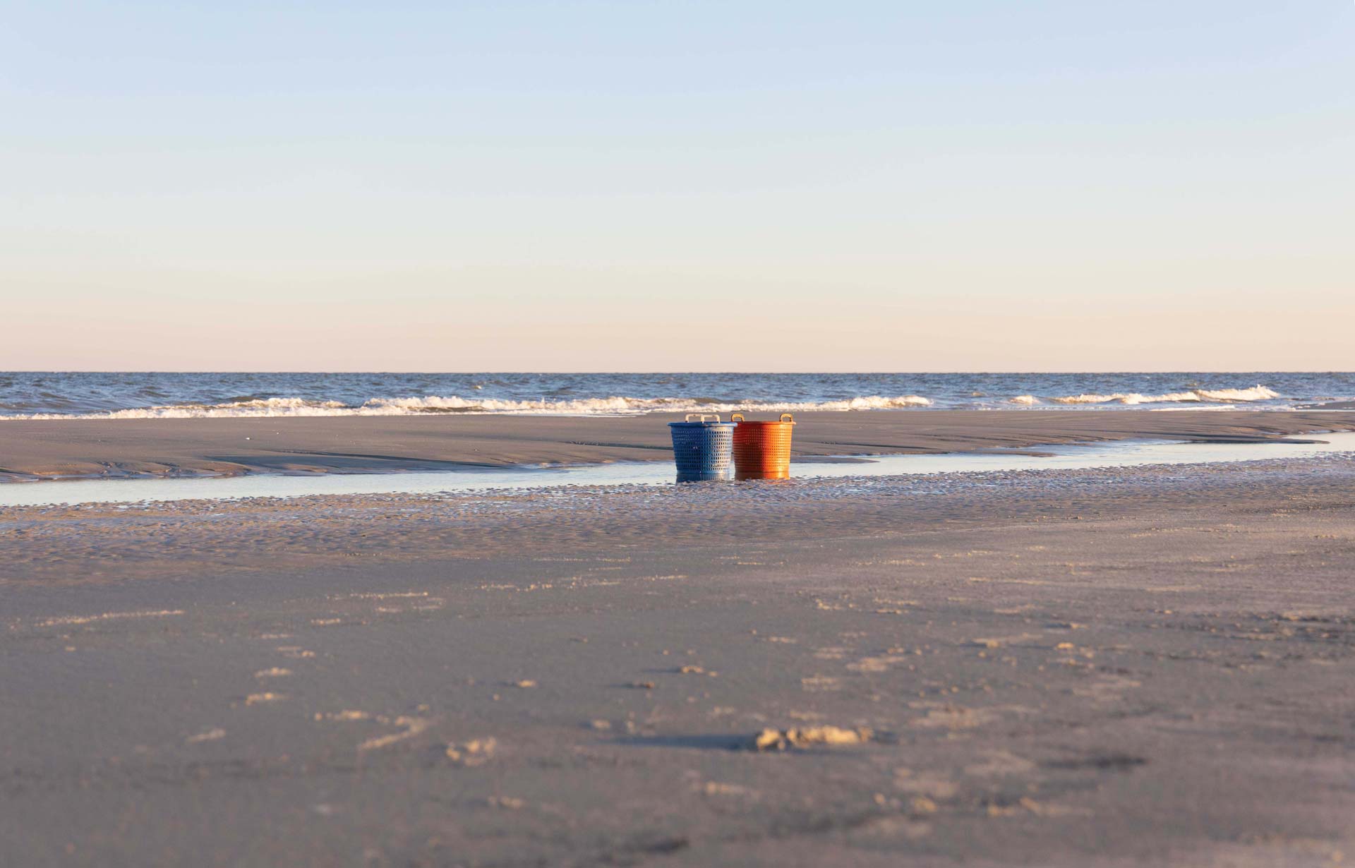 Oyster buckets await their catch on Cumberland shore.