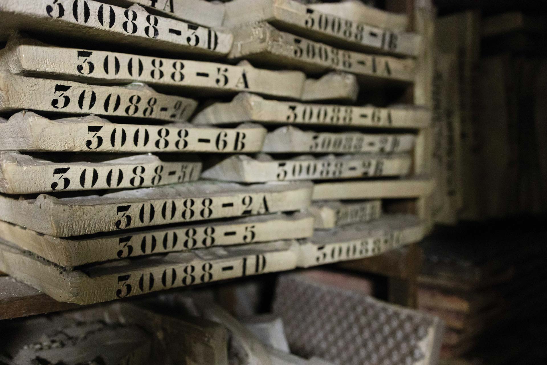 Stenciled typography organizes the woodblock catalog.